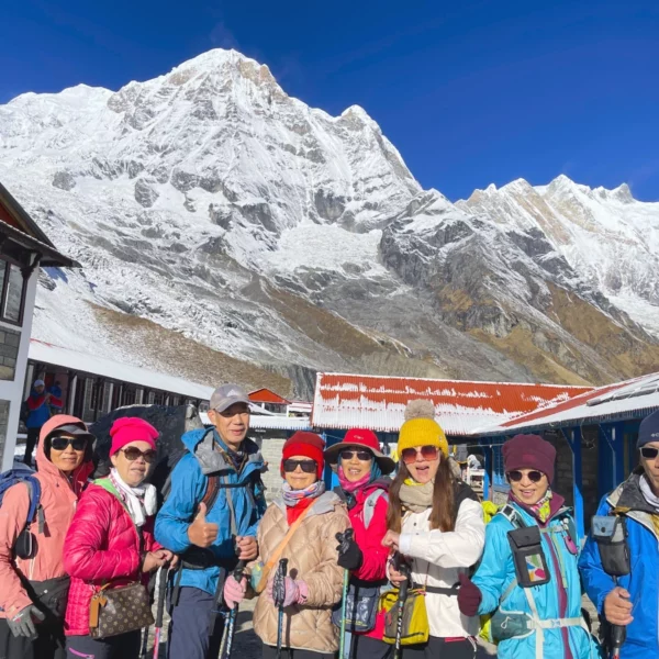 Annapurna Base Camp Trek Trekkers taking group photo with Annapurna Himalayas