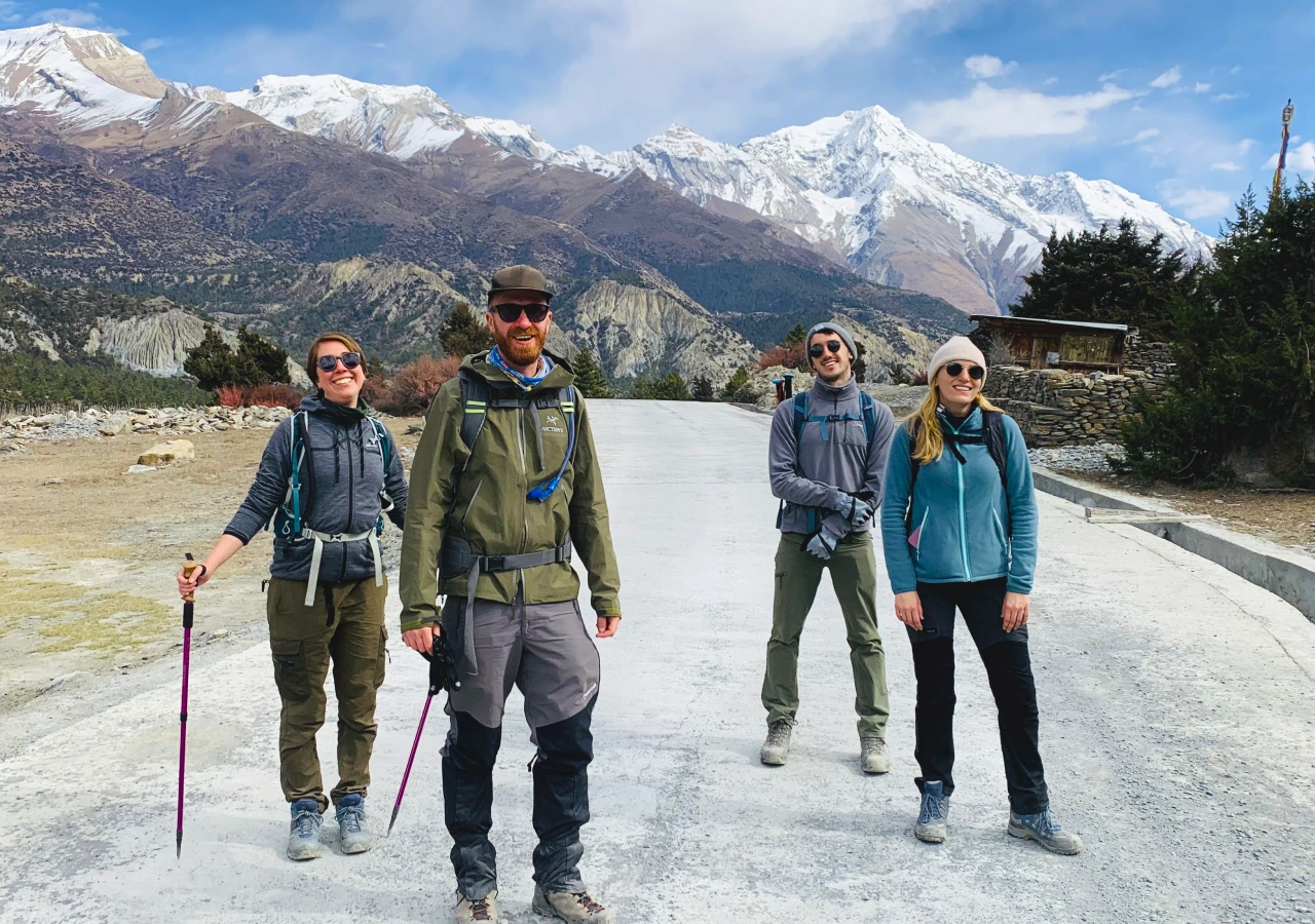 Trekkers enjoying hiking on Annapurna Circuit Trail with Himalayas in background