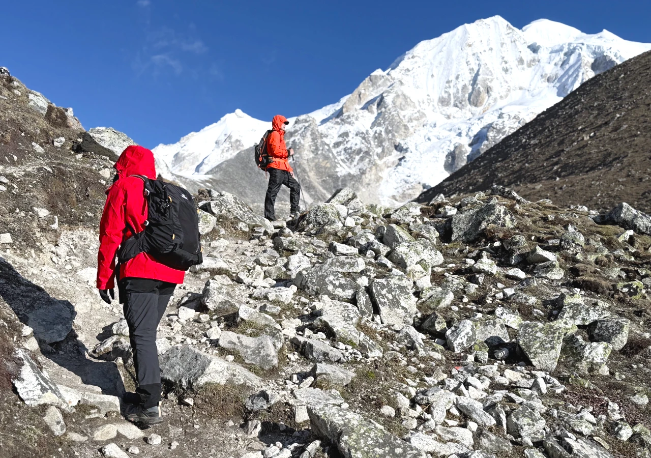Trekkers hiking and enjoying the Manaslu Circuit Trek trail with Himalayan Peaks
