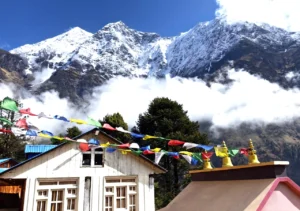 Manaslu Circuit with Tsum Valley Trekking with prayer flags and Himalayas
