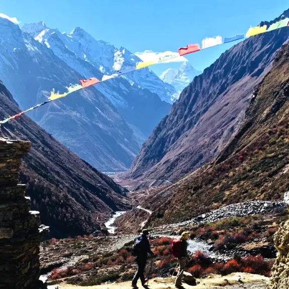 Tsum Valley Trek with himalayan peak and wide valley along the hike