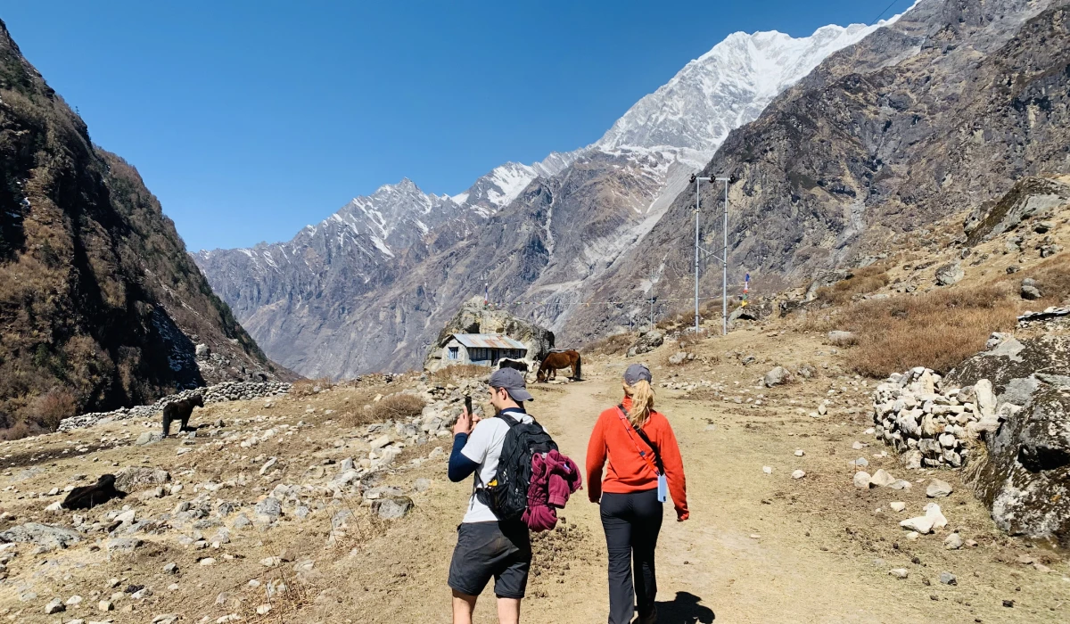 Langtang valley trekking route nepal and trekkers enjoying the hike 