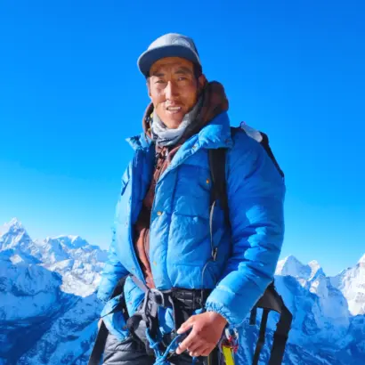 Explore Vision Nepal's climbing guide fura at the top of island peak in everest region nepal