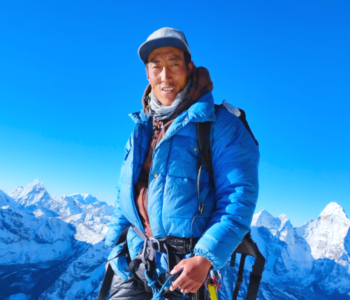 Explore Vision Nepal's climbing guide fura at the top of island peak in everest region nepal