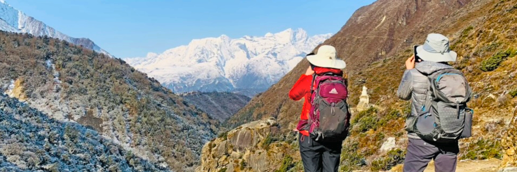 Explore vision nepal's blog blog page banner with the panoramic picture of trekking in nepal himalayas