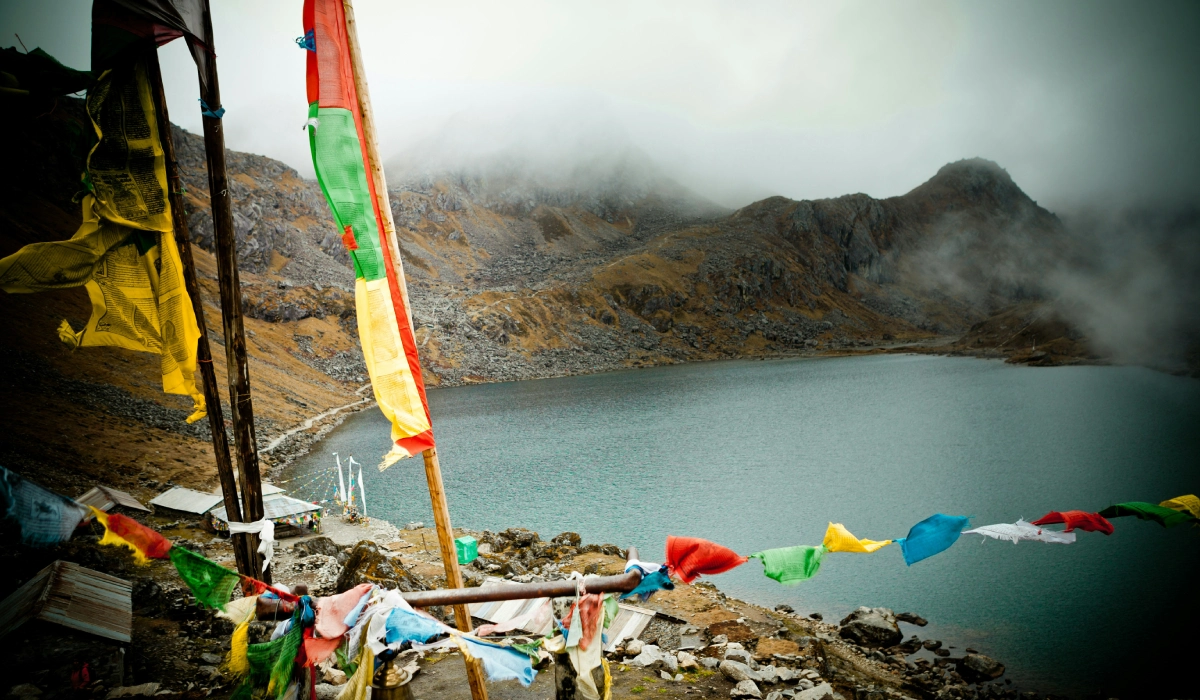 Holy gosainkunda lake with beautiful prayer flags and mountains of langtang gosainkunda nepal