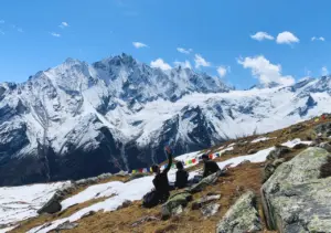 View of Langtang Lirung and Himalayas and trekkers enjoying it on the Short Langtang Valley Trek route