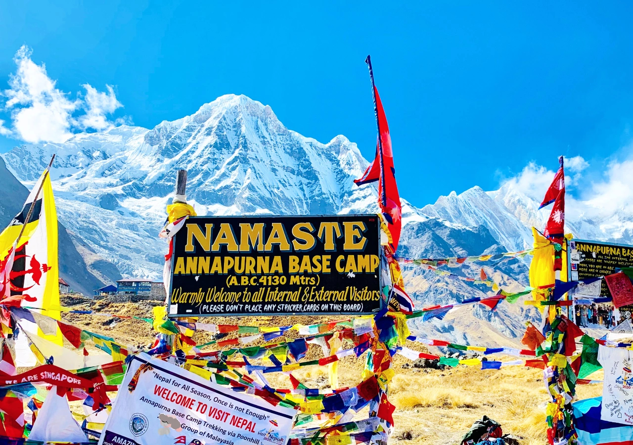 Annapurna base camp's welcome signboard and Himalayas around on short Annapurna base camp trek