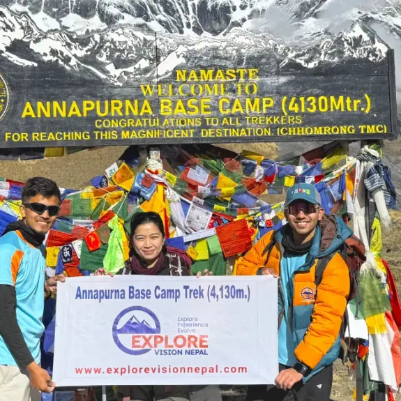 Annapurna base camp entrance and trekkers enjoying the success of the Short Annapurna Base Camp Trek with panoramic mountains view around