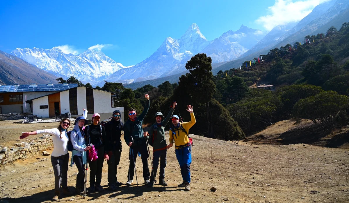 Happy trekkers at Tengboche with Ama Dablam and Lhotse during the Everest Base Camp Trek in Nepal