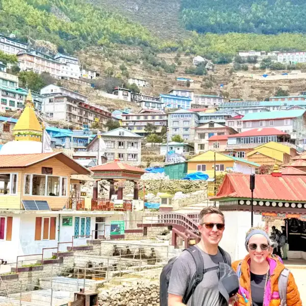 Panoramic view of Namche Bazaar Nepal with trekkers overlooking the Himalayan village en-route to Everest Base Camp Trek Nepal