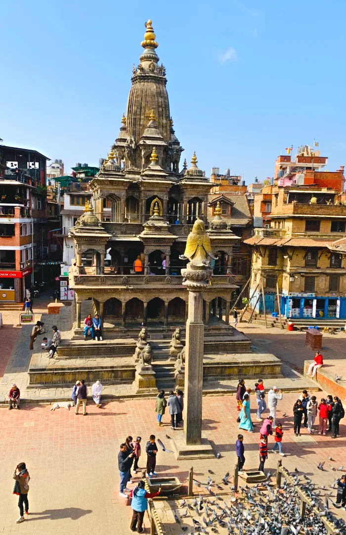 Visitors exploring the historic courtyards and temples of Patan Durbar Square Nepal