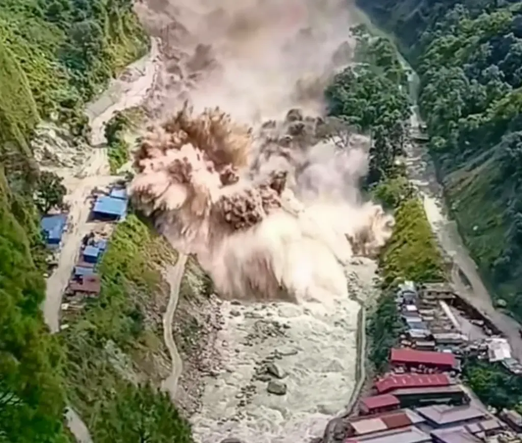 Dangerous floodwater surging along the Bhote Koshi River toward a village in Nepal