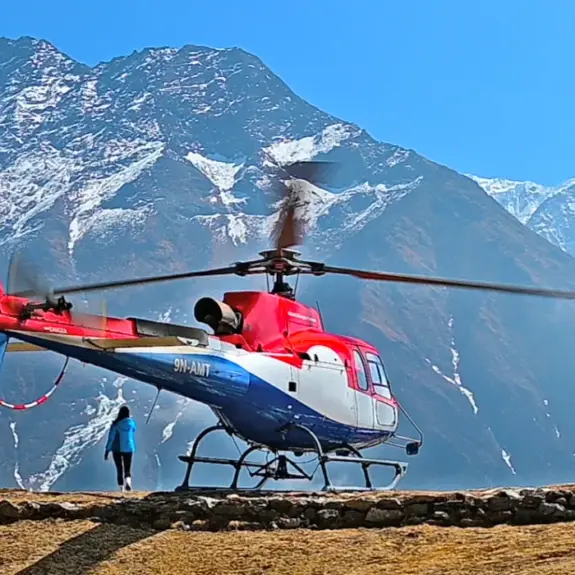 Everest Base Camp Heli Trek with helicopter ready to fly above the Himalayan Mountains in Everest region Nepal