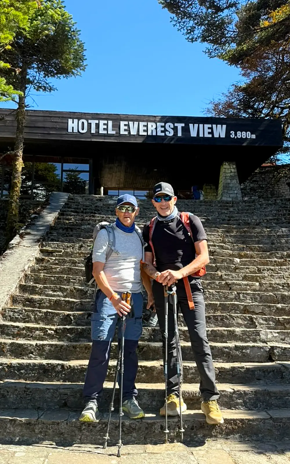Hotel Everest View and trekking groups enjoying taking picture with the Everest view hotel sign in Nepal
