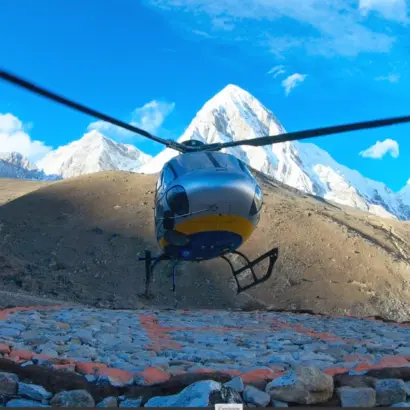 Helicopter landing at Gorak Shep helipad with mountain view around including mount Pumori during Luxury Everest Base Camp Heli Trek