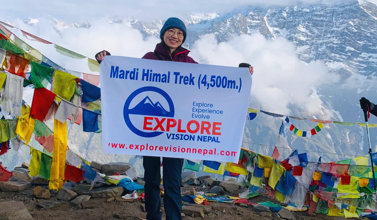 Prayer flags and Himalayan mountain views along the Mardi Himal Trek near Pokhara Nepal